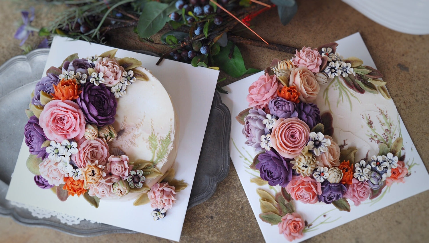 Two buttercream cakes with flower details